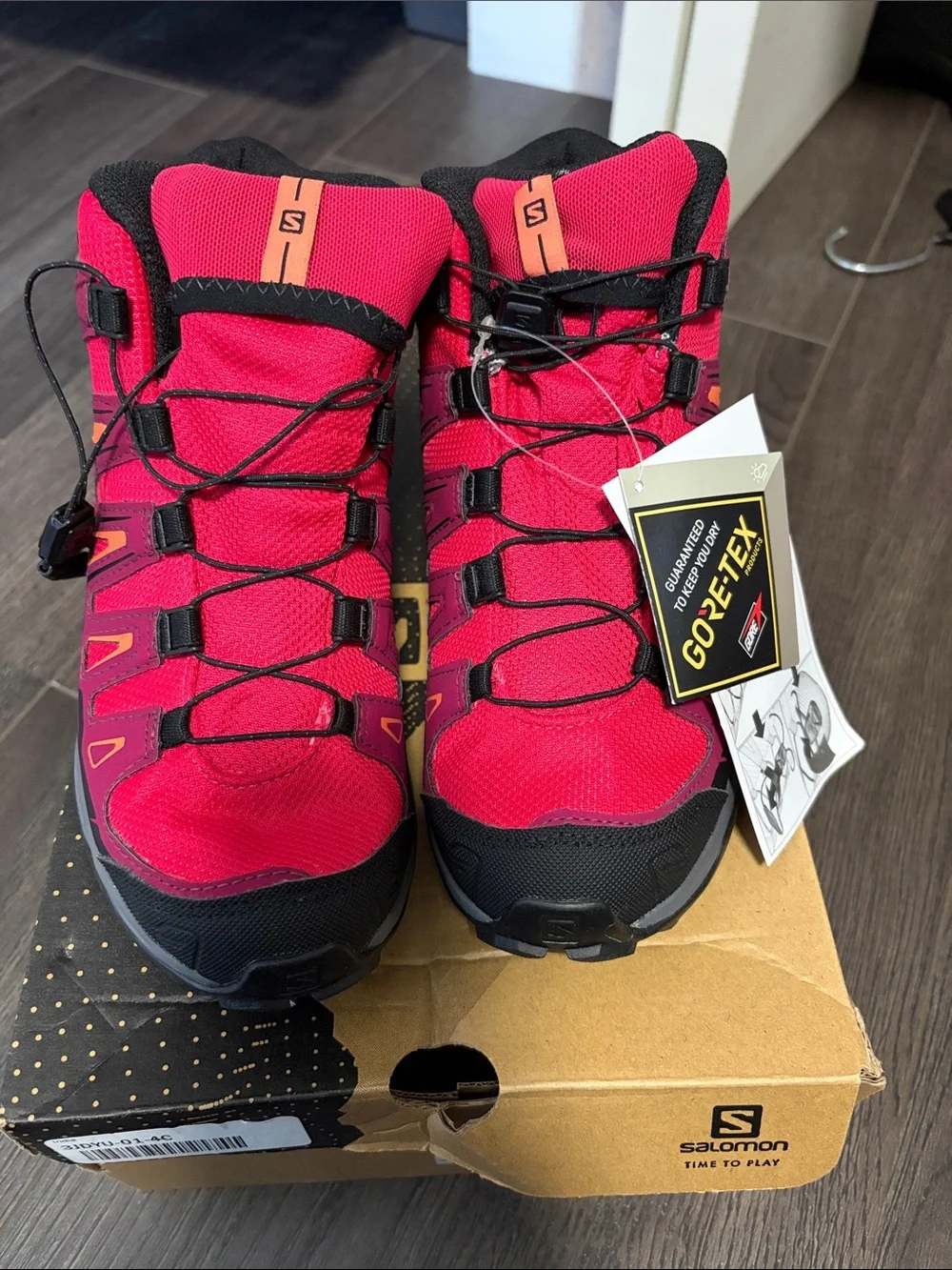 Salomon Kids' Mid-Top Hiking Boots in Bright Pink and Black